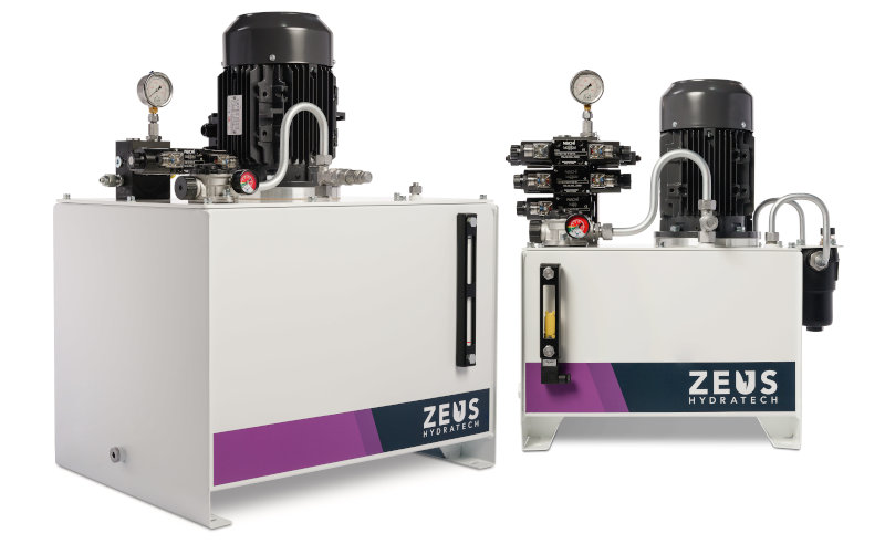 A look at two of Zeus Hydratech's Industrial Modular Hydraulic Power Packs, showcasing a variety of components and the striking white design.